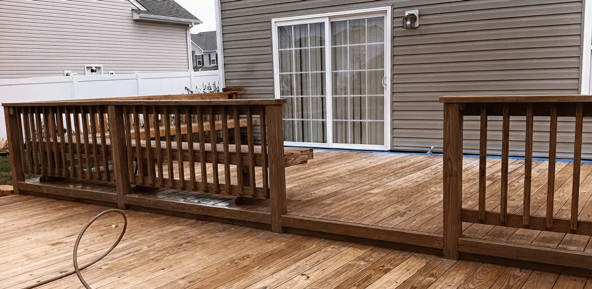 Deck sealing service protecting a backyard wood deck and railings in Richmond, VA