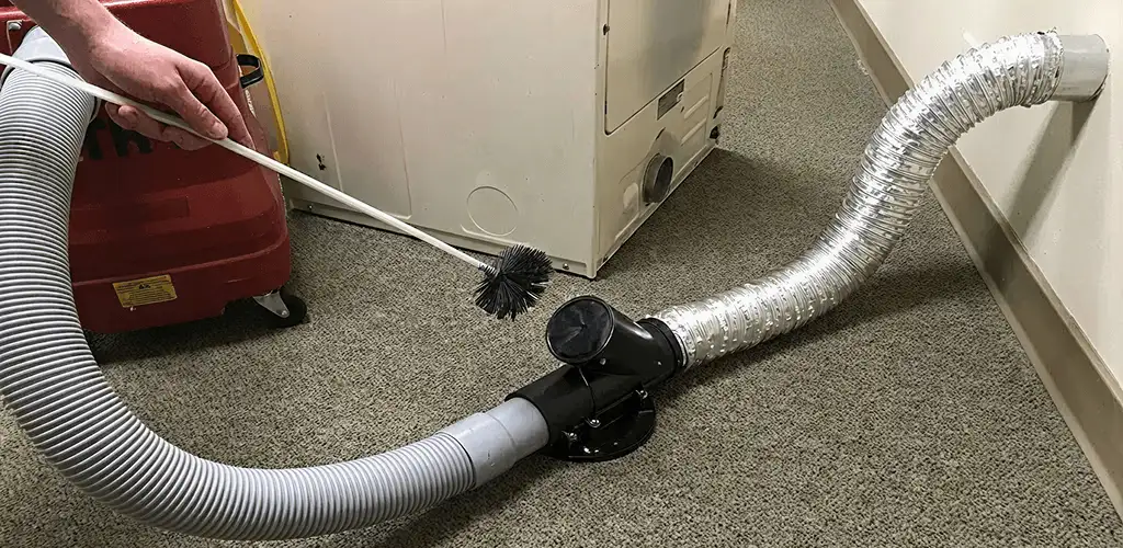 Dryer vent cleaning service removing lint from a dryer duct connection in Richmond, VA
